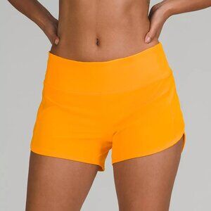 lululemon Speed Up Mid-Rise Lined Short 4" in Clementine